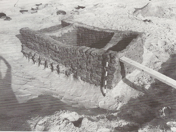 A Predynastic tomb at Minshate Abu Omar, excavated to reveal the crude brick lined substructure. Adams and Cialowicz, p. 20.