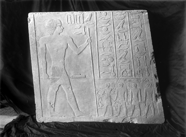 Block of relief (standing figure of Nefer, inscription, and four scribes identified as Nefru, Weni, Khentikauf, Senenuka) from northern door jamb from G 2110, [GLYPHS] Nefer. Currently in the Museum of Fine Arts Boston, acc. no. MFA 07.1002. Photo ID HUMFA_A93_NS, photo and description courtesy of the Giza Archives maintained by Harvard University and the Museum of Fine Arts Boston, online at Digital Giza.